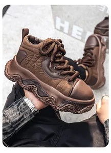Close-up of brown men's chunky platform sneaker with quilted fabric and thick laces