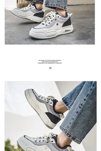 Detailed view of men's chunky platform sneakers with breathable mesh in grey and white.