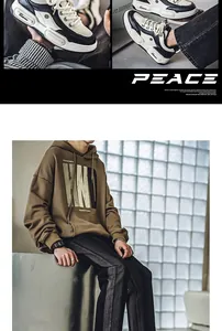 Close-up detail of breathable thick-sole bread sneakers with model in brown hoodie