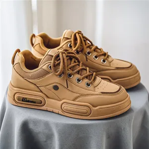 Stylish tan chunky platform sneakers with breathable mesh and leather paneling design.