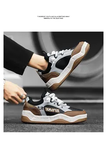 Close-up of stylish thick-sole sneakers featuring brown leather and black mesh panels