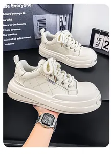 Detailed view of men's cream platform sneakers featuring diamond-stitched leather