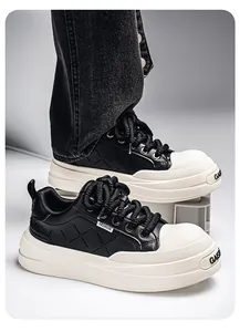 Close-up detail of men's chunky platform leather sneakers in stylish black and white