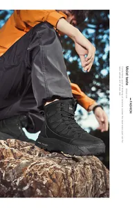 Detailed shot of black tactical outdoor boots worn by a model on rocky terrain for hiking