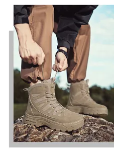 Durable tan outdoor tactical military boots with thick soles shown on rocky terrain