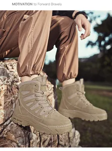 Close-up of tan tactical outdoor boots with rugged thick soles in a natural rock setting