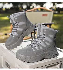 Detailed view of grey waterproof tactical boots with thick anti-slip sole