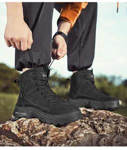 Close-up of black outdoor combat boots with thick sole for hiking and tactical use
