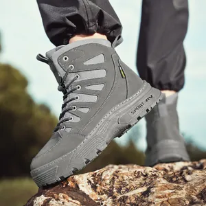 Men's grey thick-soled waterproof outdoor tactical hiking boots shown on rock