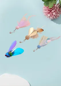 Close-up of flying insect cat teaser wand replacement heads with feathers and bells.