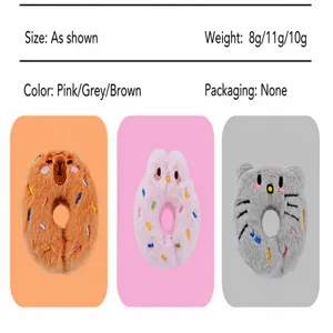 Macro detail of cute animal shaped donut plush catnip toys in pink, grey and brown colors.