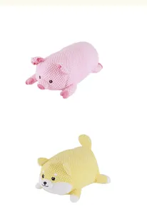 Detailed view of pink pig and yellow corgi plush squeaky chew toys with durable texture