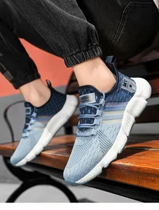 Detailed macro view of blue flyknit athletic running shoes with textured popcorn sole
