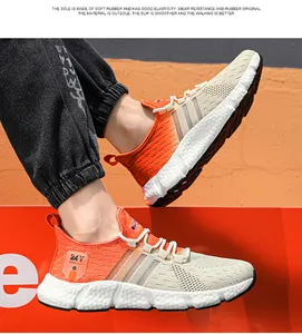 Macro view of breathable orange knit running shoes with thick cushioned popcorn sole