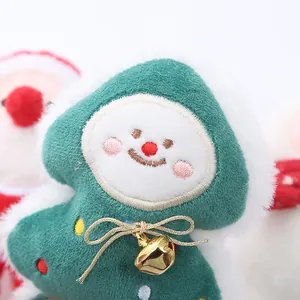 Soft plush Christmas tree cat toy with bell and festive smiling face design.