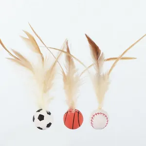 Detailed view of feather cat toys with soccer, basketball, and baseball designs