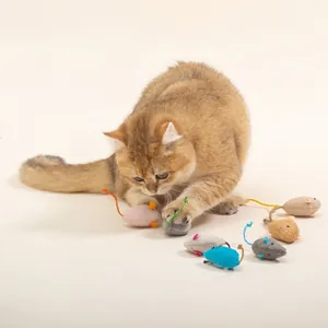 Cute cat playing with colorful plush mouse toys filled with organic herbal catnip