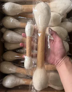 Hand showing oversized wool felt cotton swab cat toys for teeth cleaning and play