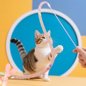 Interactive cat teaser wand featuring a colorful sequined dragonfly and flexible wire tube