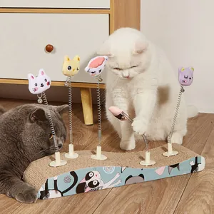 Detailed view of cats playing with a wave-shaped cat scratcher board and spring toys