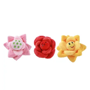 Set of three colorful plush flower-shaped sniffing and chewing toys for dogs with smiley faces.