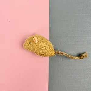 Detail of catnip mouse toy featuring textured bouclé fabric and durable sisal rope tail