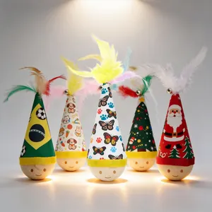 Detail view of various colorful tumbler cat toys with feathers and festive patterns