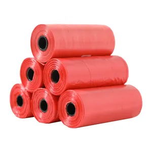 Detail view of a pyramid stack of six red pet waste bag rolls for waste collection
