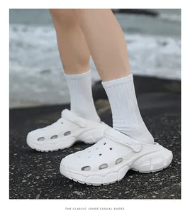 Detailed side view of stylish white chunky platform clogs for summer casual outdoor wear