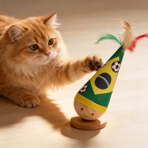 Detailed view of wooden tumbler cat toy with Brazil flag cone and colorful feathers