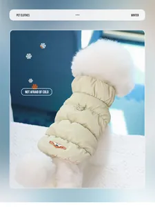 Detail of a beige quilted pet puffer vest with dual leash D-rings for winter warmth