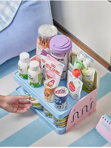 Detail of two-tier pet snack storage rack filled with cat food cans and pouches