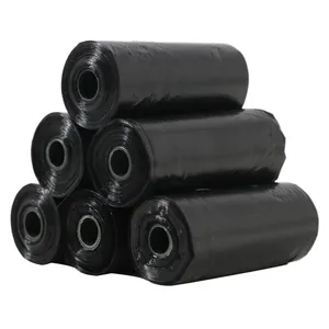 Detailed view of six black pet waste bag rolls stacked together on a clean white background