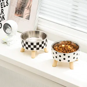 Elevated stainless steel pet bowls featuring checkerboard and polka dot designs