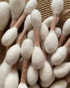 Detail showing the soft wool texture of these large cotton swab-shaped catnip toys.