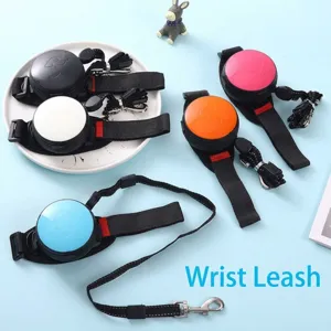 Detail showing various colors of wrist-style retractable dog and cat leashes on blue.