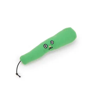 Detail of green vegetable shaped catnip cat toy with embroidered face