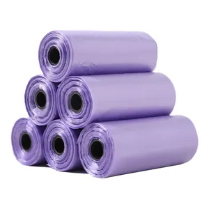 Macro detail shot showing several rolls of lavender purple dog waste bags in a stack