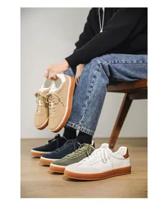 Macro view of stylish men's suede sneakers in multiple colors for casual autumn wear.