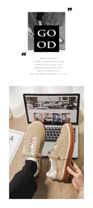 Close-up of khaki suede sneakers with brown gum soles on a laptop backdrop