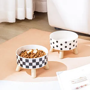 Elevated pet bowls with checkered and polka dot patterns for cats and dogs
