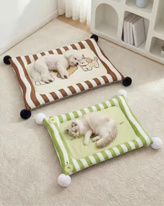 Soft striped pet cooling pads with decorative pom-poms and cute animal illustrations