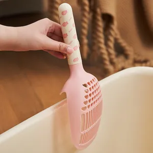 Ergonomische roze kattenbakschep met hartvormige poriën en schattig handvat
