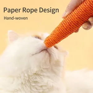 Close-up of hand-woven paper rope cat toy in carrot shape with cat.