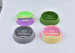 Detailed view of four silicone pet slow feeder bowls in solid and camouflage colors