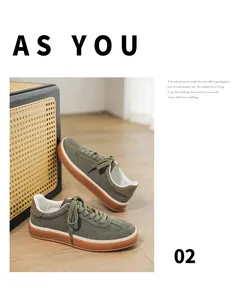 Detailed shot of green suede men's sneakers with brown gum soles in a cozy vintage setting