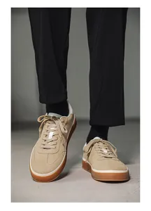 Close-up of stylish men's suede board shoes with gum sole in casual setting