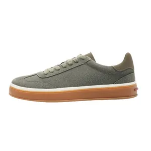 Men's olive green suede casual sneakers featuring a gum sole on a white background