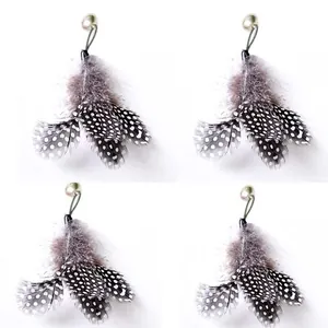 Detailed view of four natural spotted feather cat teaser wand replacement parts