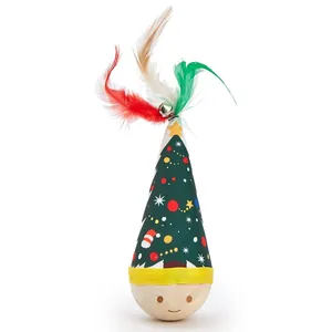 Close-up of Christmas tree pattern cat tumbler toy with festive feathers and bell